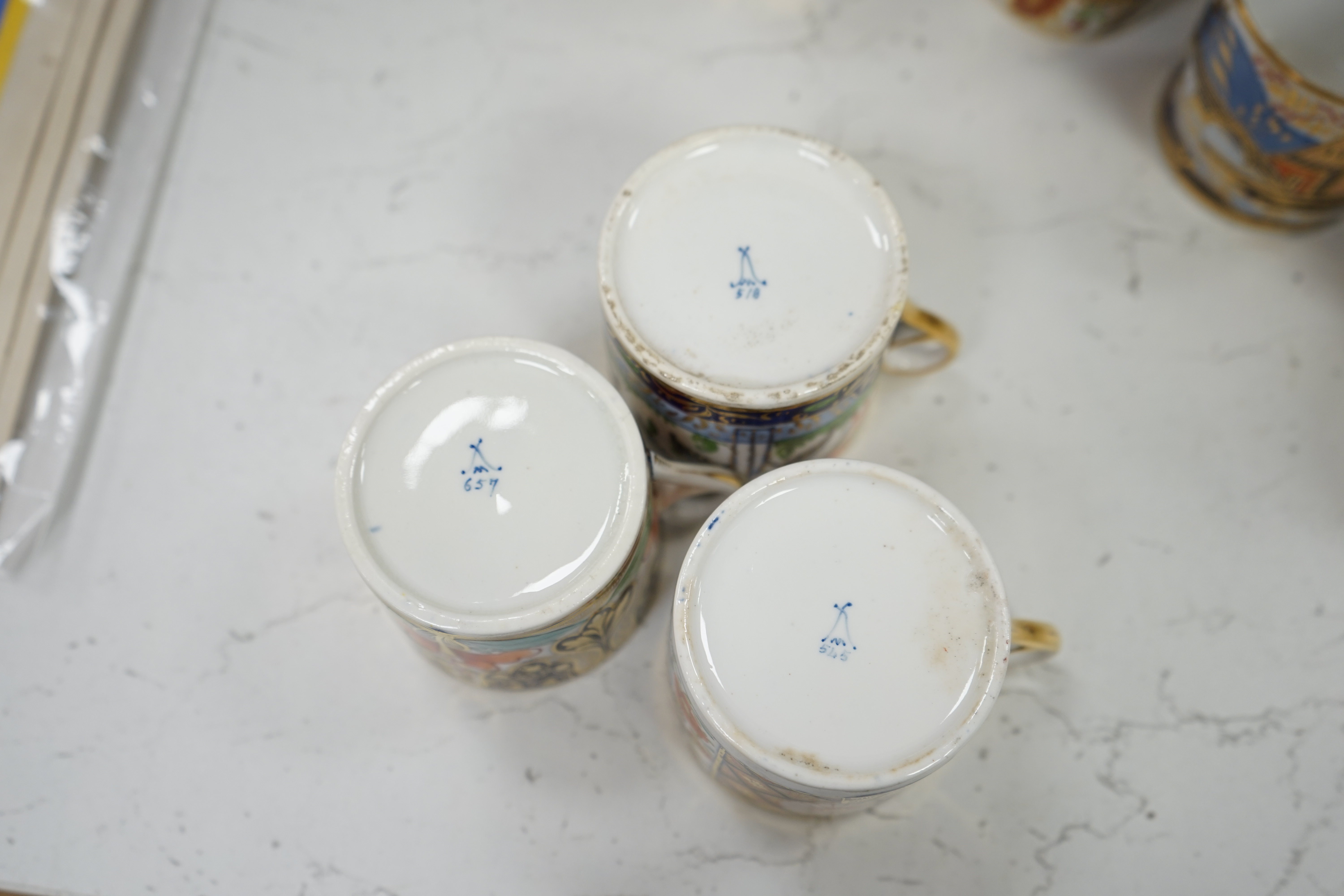 Twelve mixed 1800-1820 English porcelain Imari patterned coffee cans
